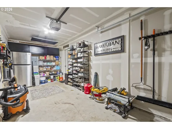 a room with gym equipment and a view of living room