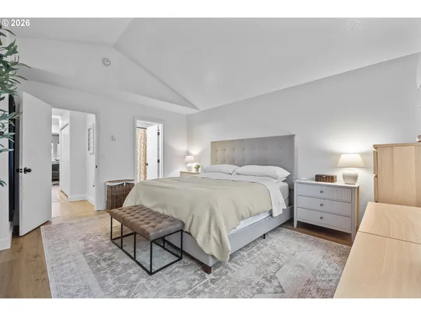 a bed room with a bed and a chair