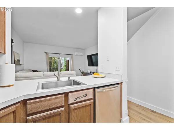 a view of a kitchen from the sink
