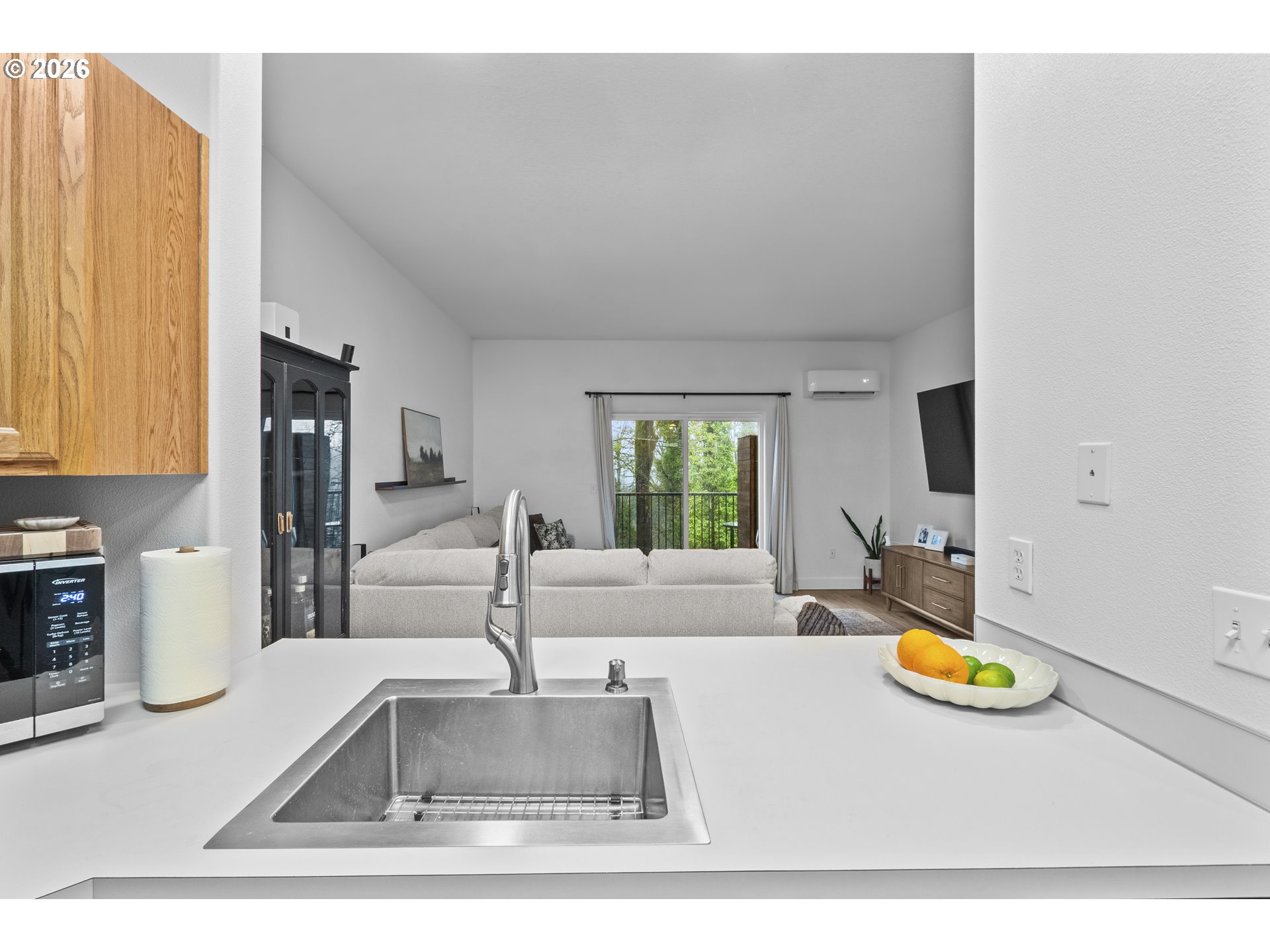 13949 Beavercreek Road, Unit 114 Oregon City, OR 97045 - Photo 7 of 27 a kitchen with a stove a sink and a view of living room