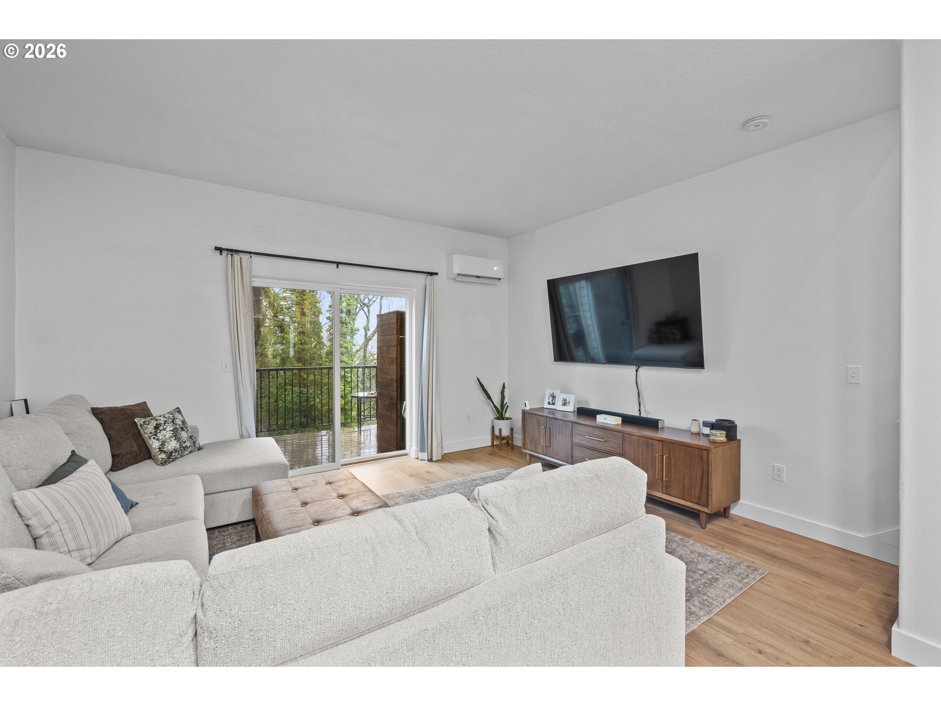 13949 Beavercreek Road, Unit 114 Oregon City, OR 97045 - Photo 9 of 27 a living room with furniture and a flat screen tv