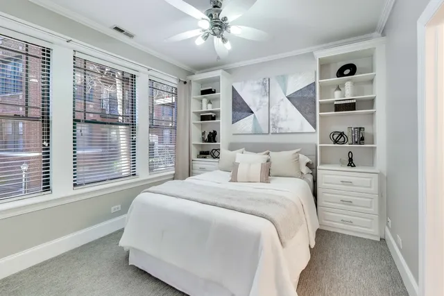 a bedroom with a large bed and a window