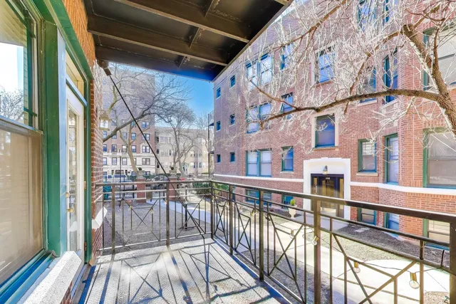 a view of a balcony with wooden floor