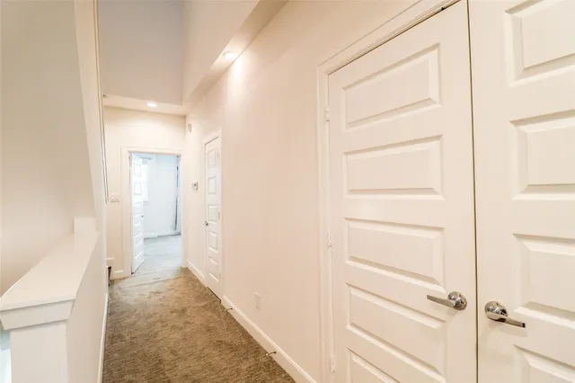 a view of a bathroom from a hallway