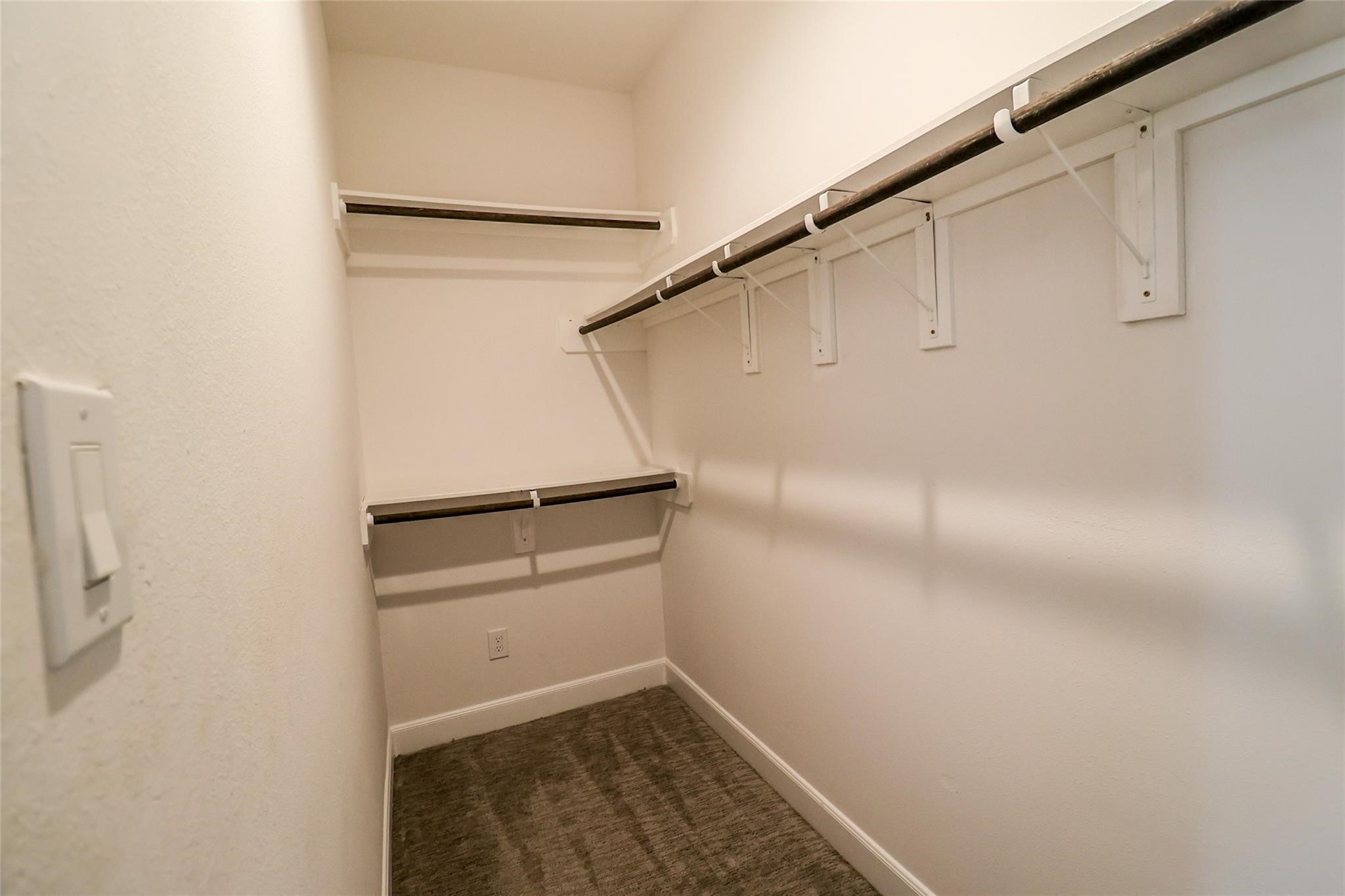 2745 Clinton Drive Houston, TX 77020 - Photo 18 of 32 a view of walk in closet with empty racks