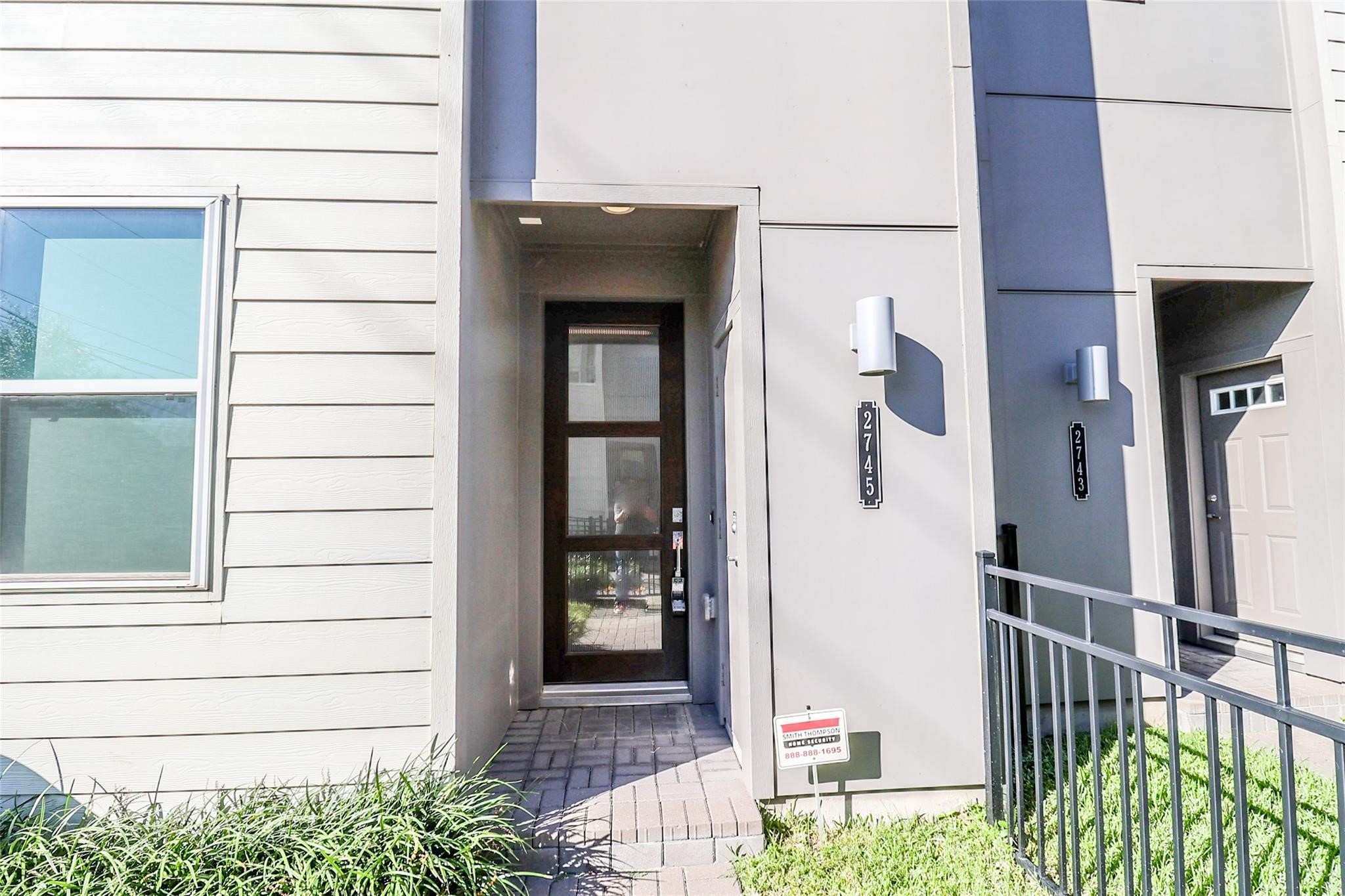 2745 Clinton Drive Houston, TX 77020 - Photo 2 of 32 a view of a house with a door and wooden bench