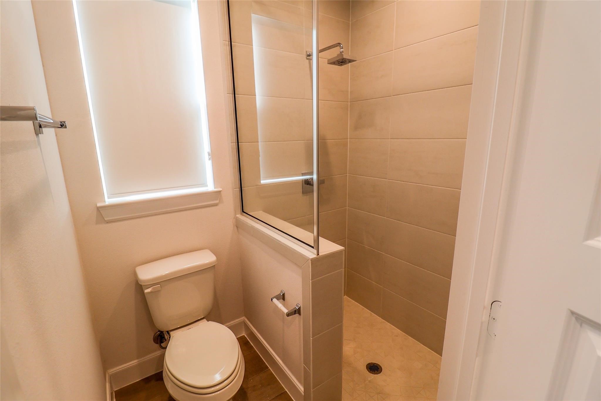 2745 Clinton Drive Houston, TX 77020 - Photo 25 of 32 a white toilet sitting next to a bathroom sink