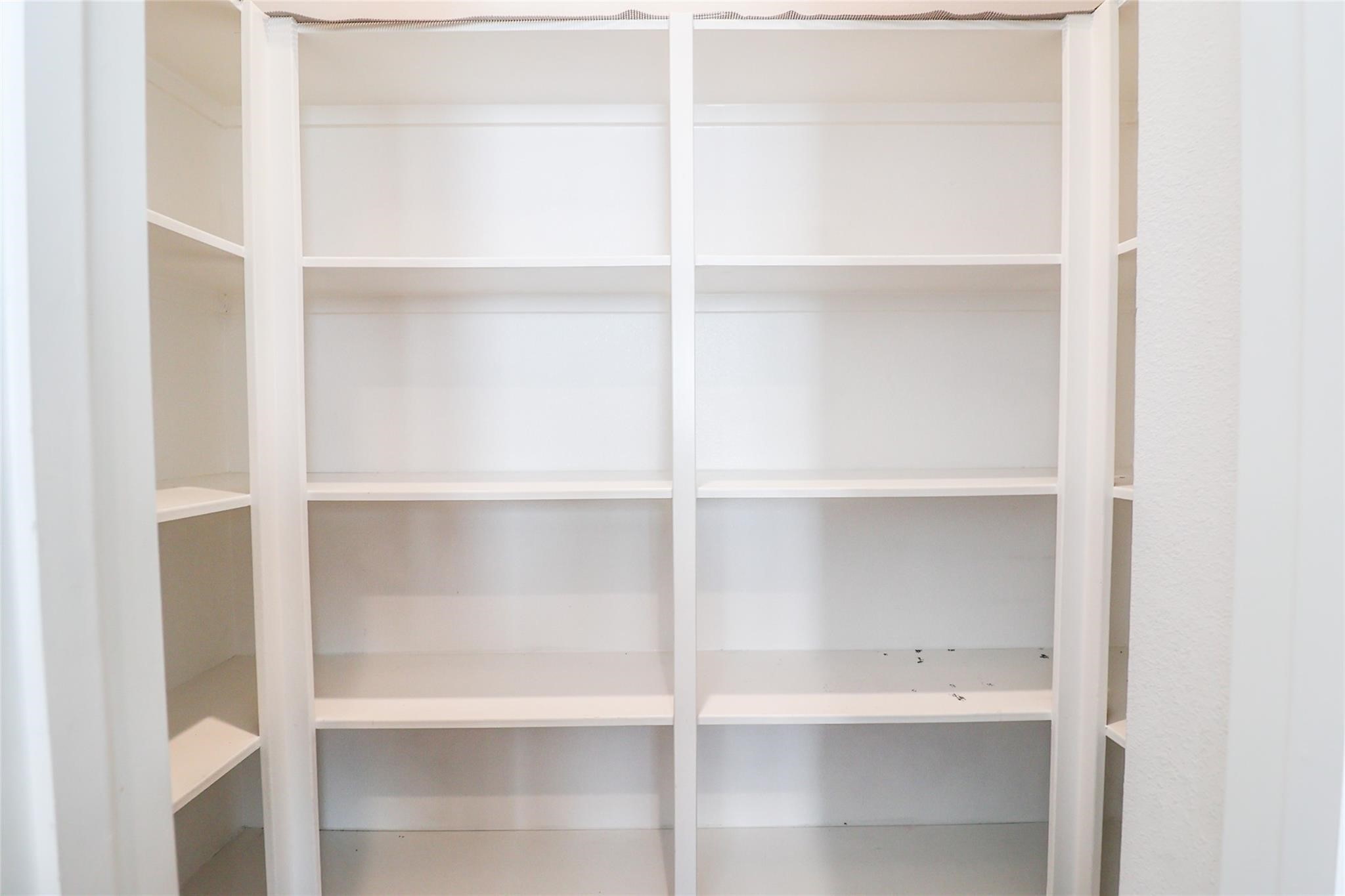 2745 Clinton Drive Houston, TX 77020 - Photo 28 of 32 a view of walk in closet with empty racks