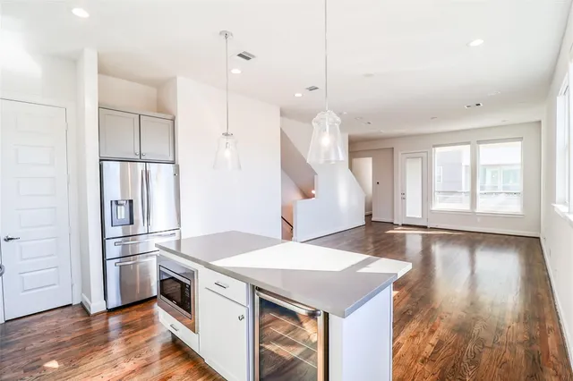 a kitchen with a stove a sink and a refrigerator