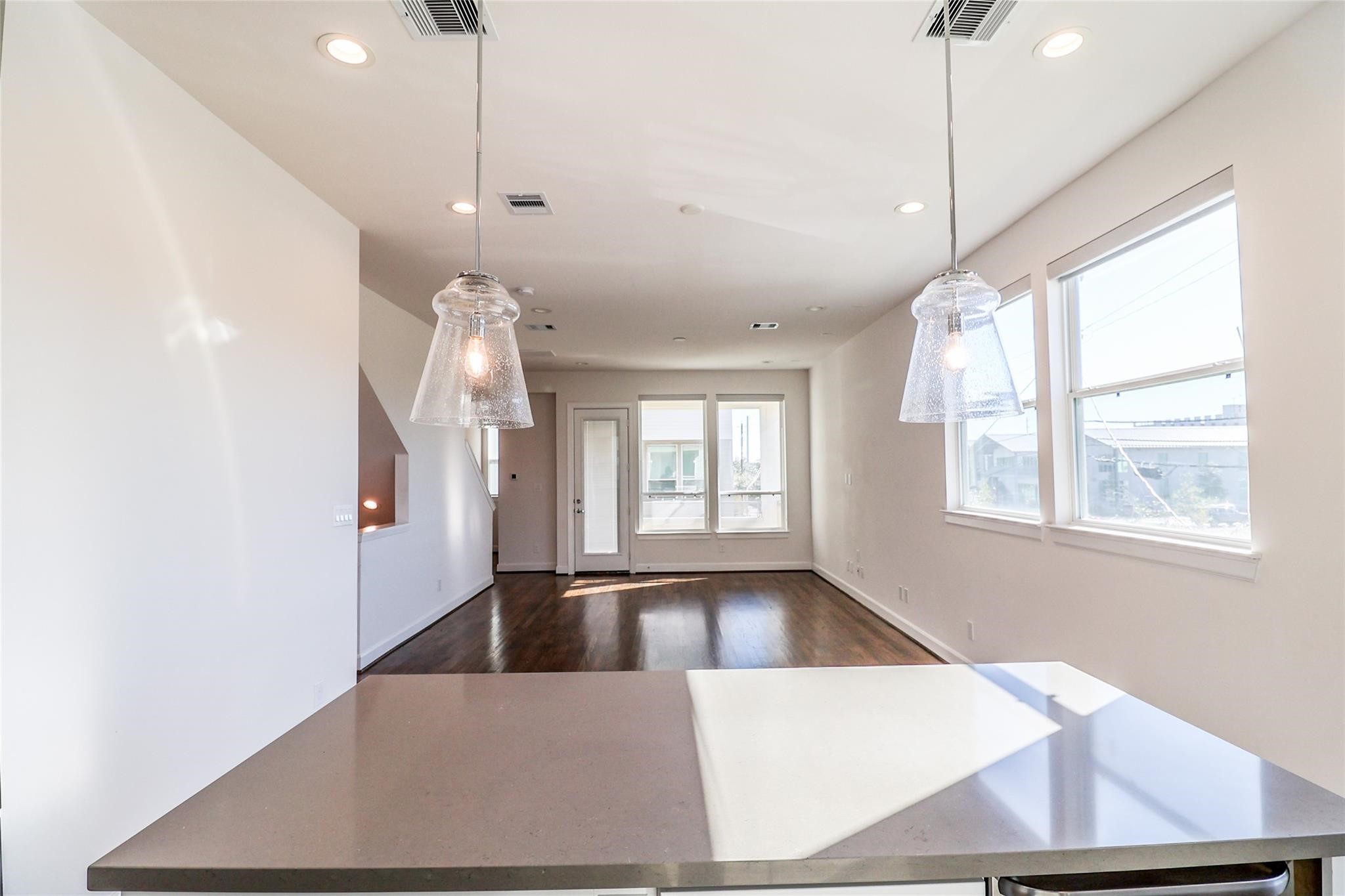 2745 Clinton Drive Houston, TX 77020 - Photo 9 of 32 a view of an empty room with window and wooden floor
