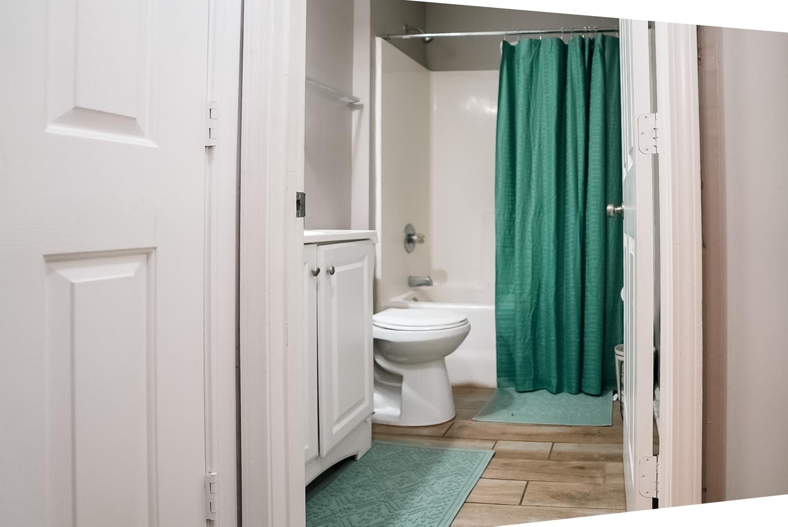 936 Porter Street Memphis, TN 38126 - Photo 11 of 22 Full bath with vanity, shower / bathtub combination with curtain, and light wood finished floors
