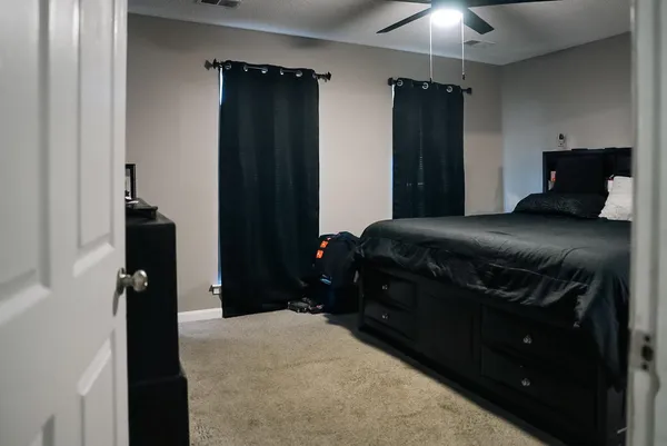 a bedroom with a bed and a closet