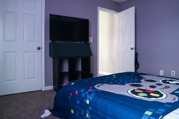 a bedroom with a bed and a table in it