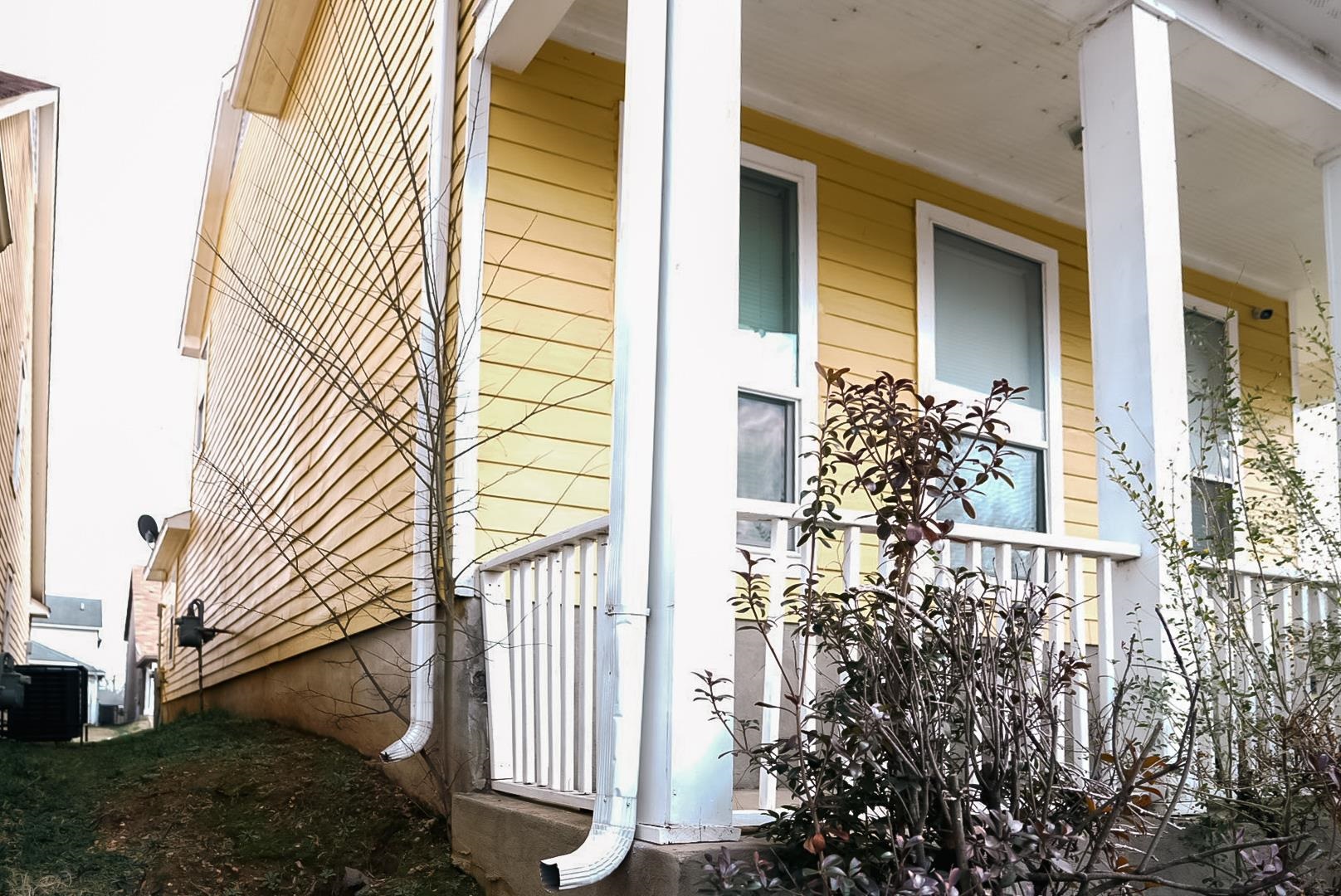 936 Porter Street Memphis, TN 38126 - Photo 2 of 22 View of side of property with covered porch and a central AC unit