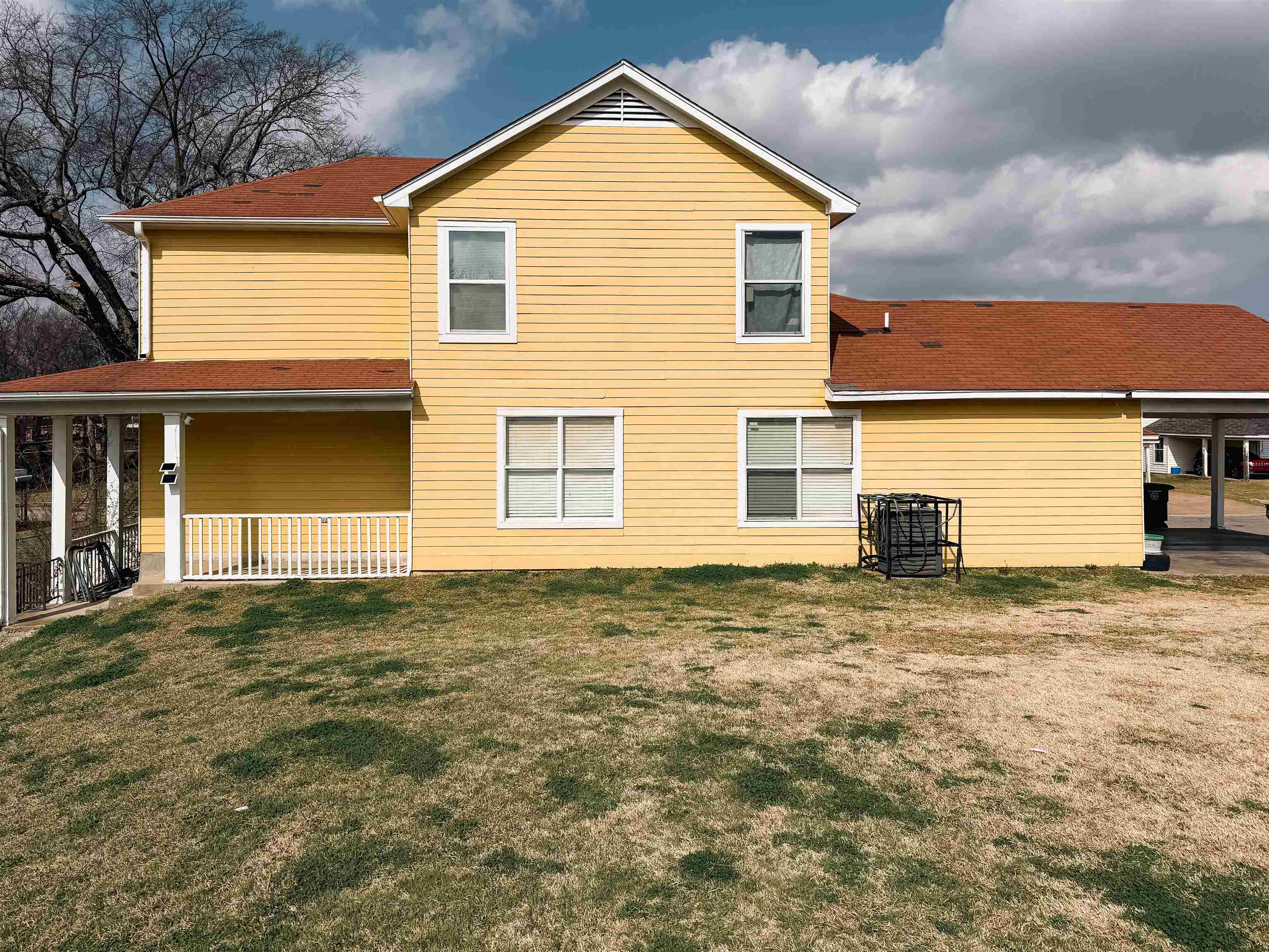 936 Porter Street Memphis, TN 38126 - Photo 3 of 22 Back of property featuring a lawn and roof with shingles