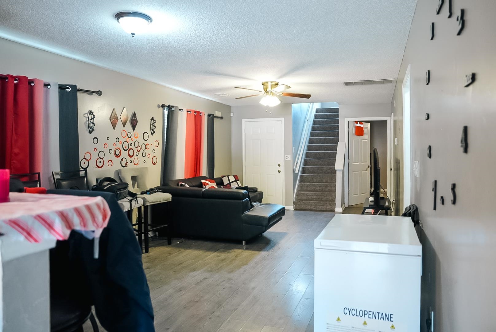 936 Porter Street Memphis, TN 38126 - Photo 4 of 22 Living area with a textured ceiling, light wood-style flooring, and a ceiling fan