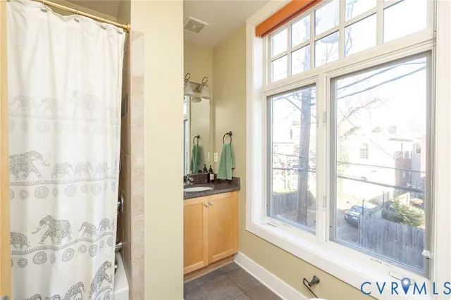 a view of a room with a large window