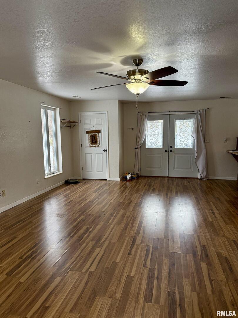 2407 Selmaville Road Salem, IL 62881 - Photo 4 of 19 a view of empty room with wooden floor and fan