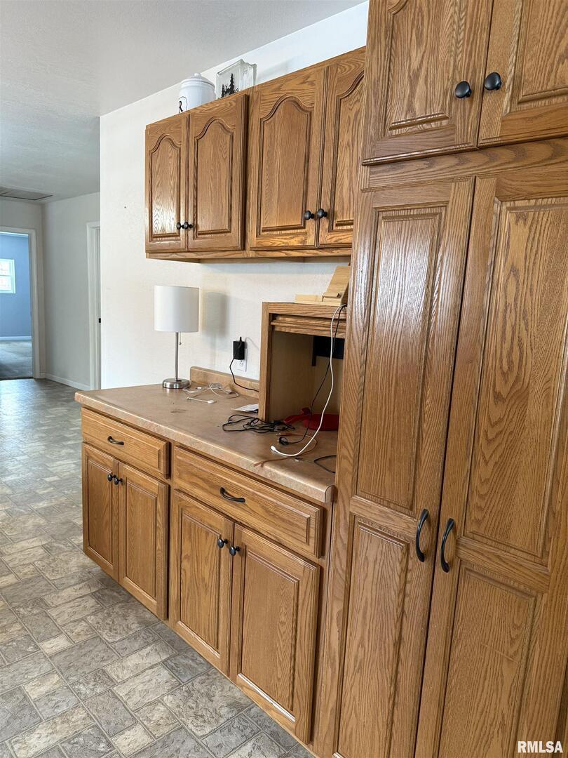2407 Selmaville Road Salem, IL 62881 - Photo 10 of 19 a kitchen with stainless steel appliances granite countertop a refrigerator and cabinets