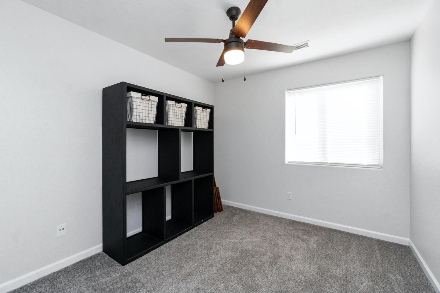 1435 Summerwind Drive Lemoore, CA 93245 - Photo 12 of 32 a view of an empty room with a window