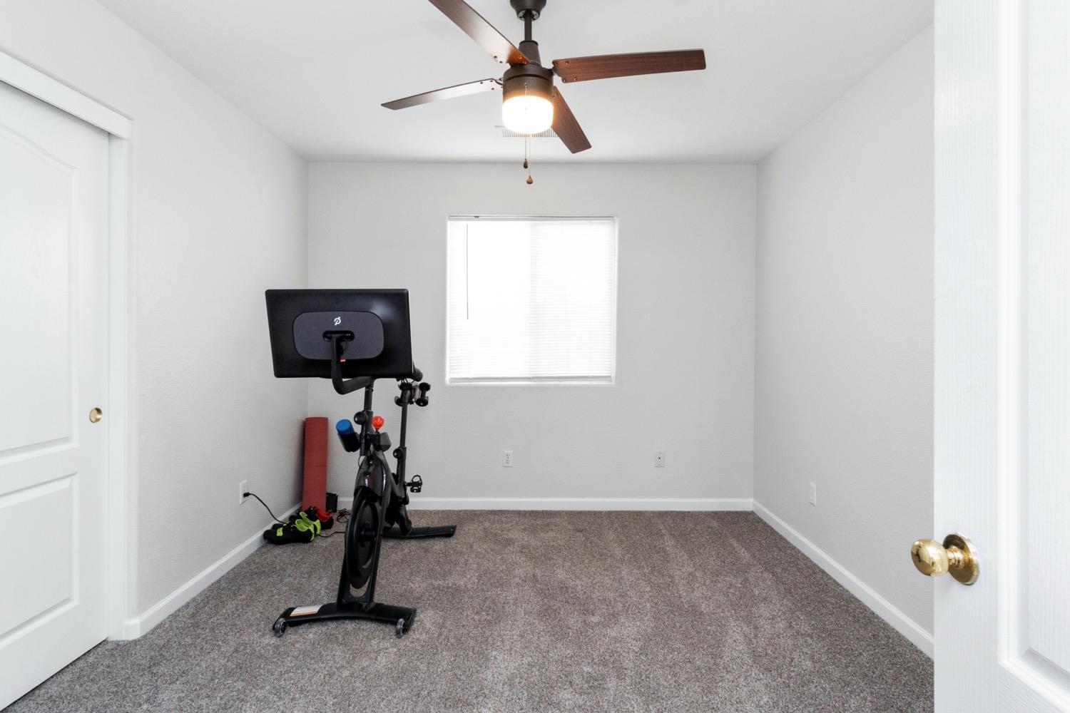 1435 Summerwind Drive Lemoore, CA 93245 - Photo 17 of 32 a view of room with gym equipment