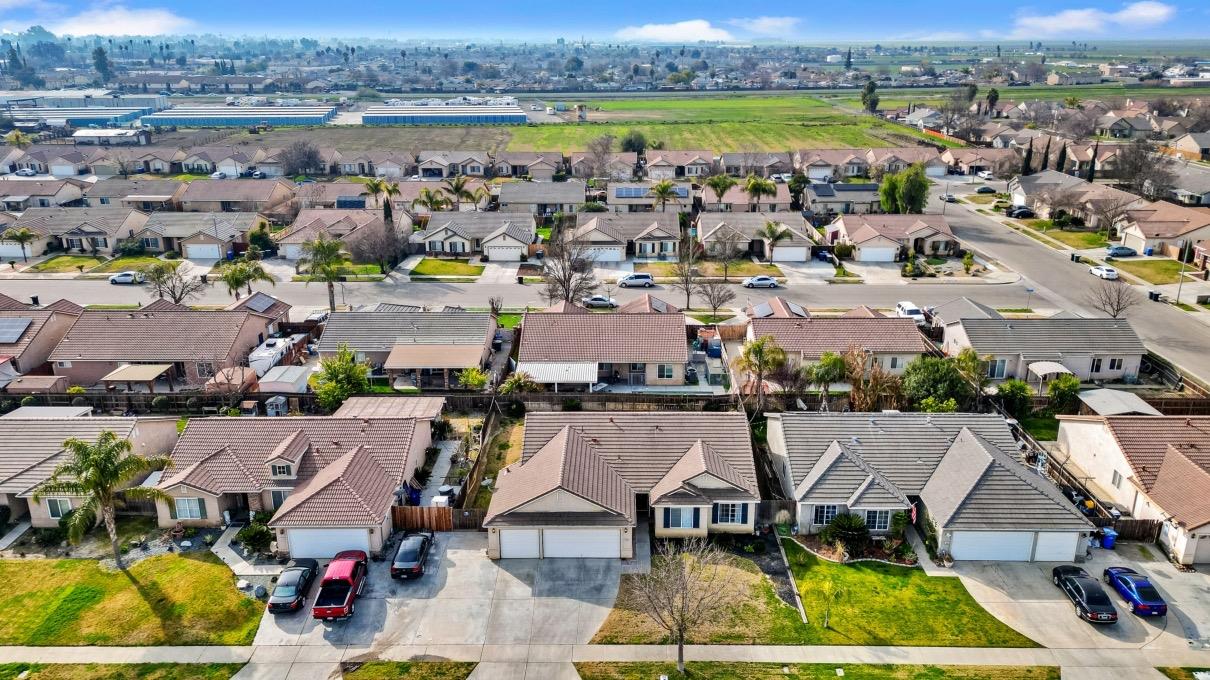 1435 Summerwind Drive Lemoore, CA 93245 - Photo 32 of 32 an aerial view of a house with a swimming pool yard and outdoor seating