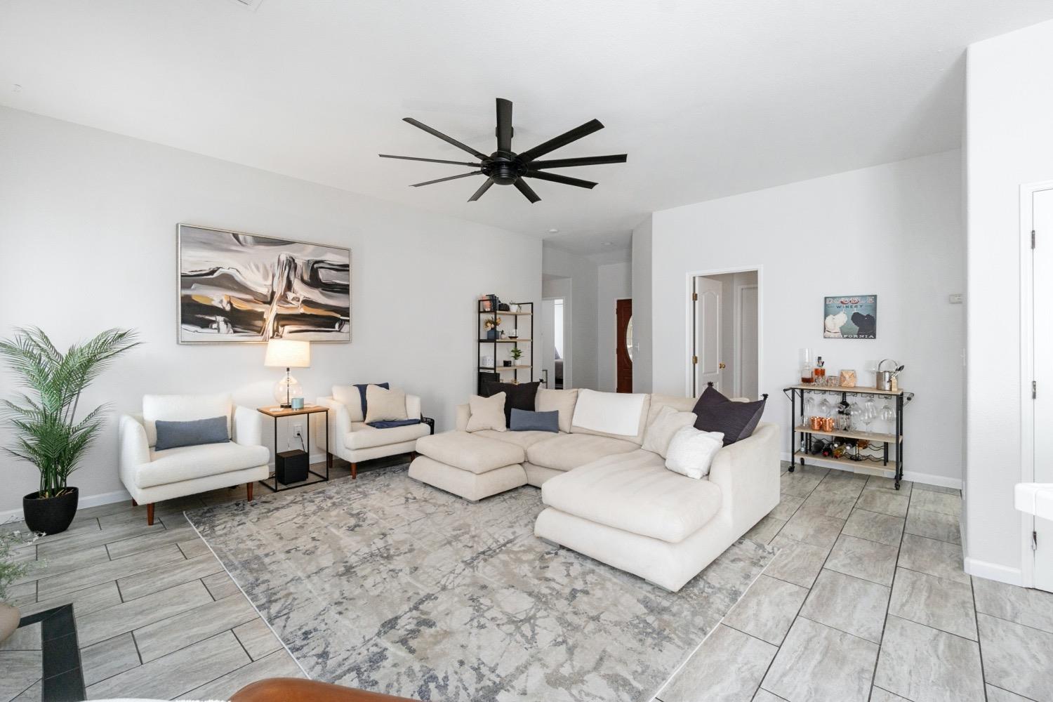 1435 Summerwind Drive Lemoore, CA 93245 - Photo 6 of 32 a living room with furniture and a large window