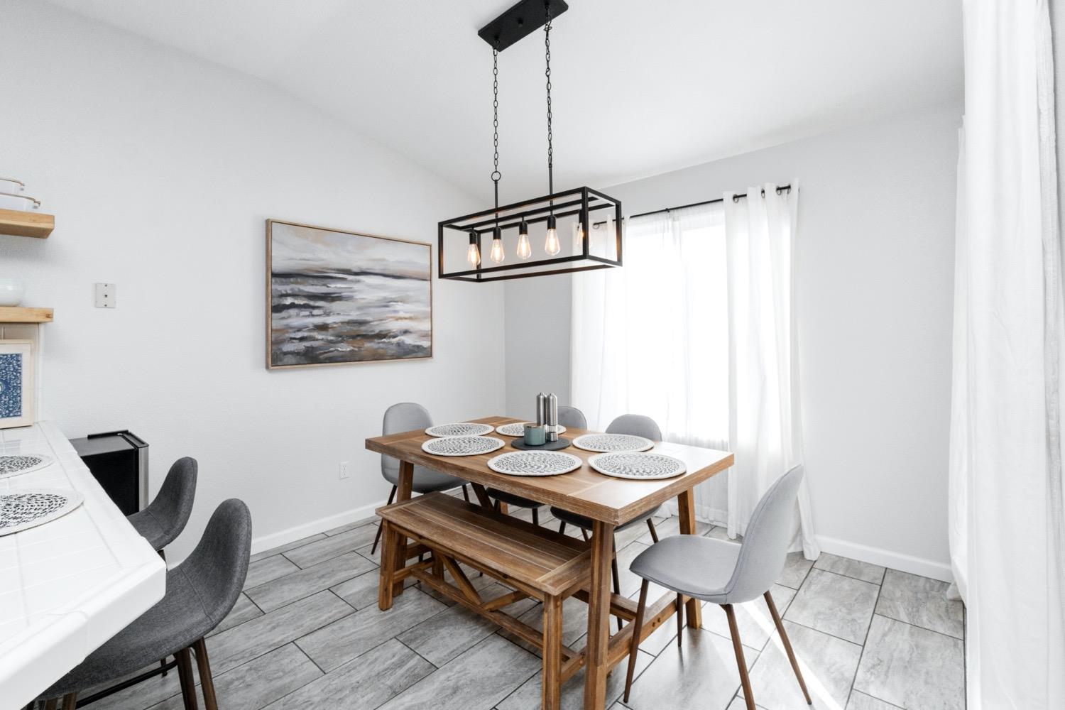 1435 Summerwind Drive Lemoore, CA 93245 - Photo 7 of 32 a dining room with furniture and window