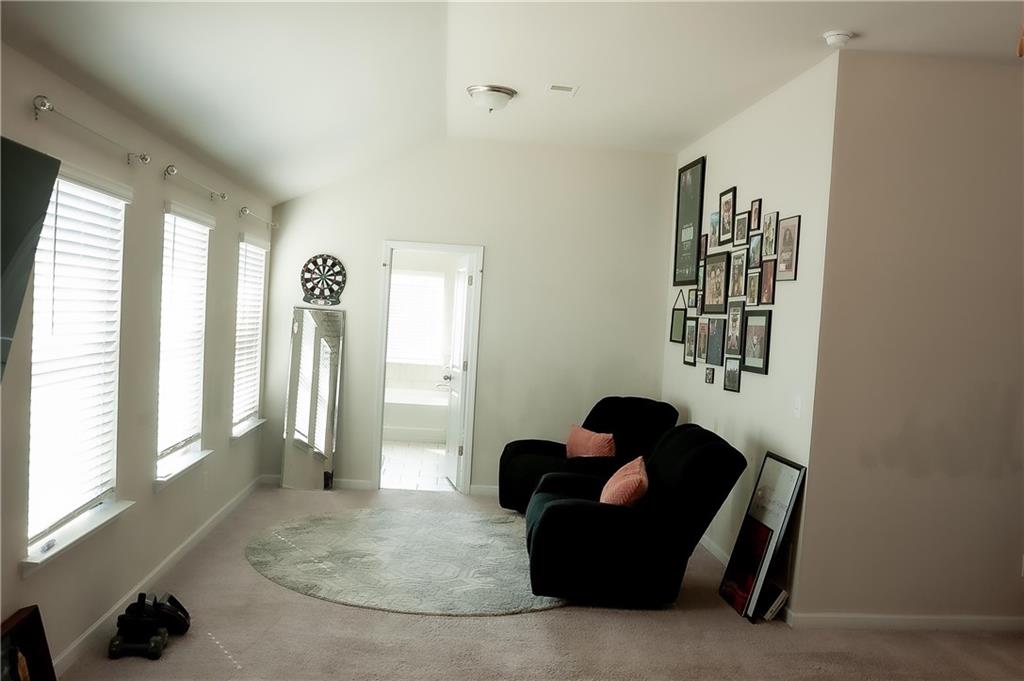 3605 Broadwick Lane Stonecrest, GA 30038 - Photo 11 of 18 a living room with furniture and a large window