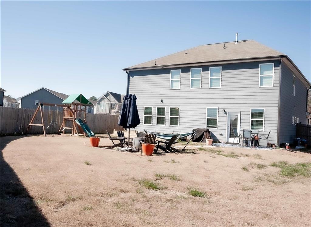 3605 Broadwick Lane Stonecrest, GA 30038 - Photo 18 of 18 a view of a house with outdoor seating