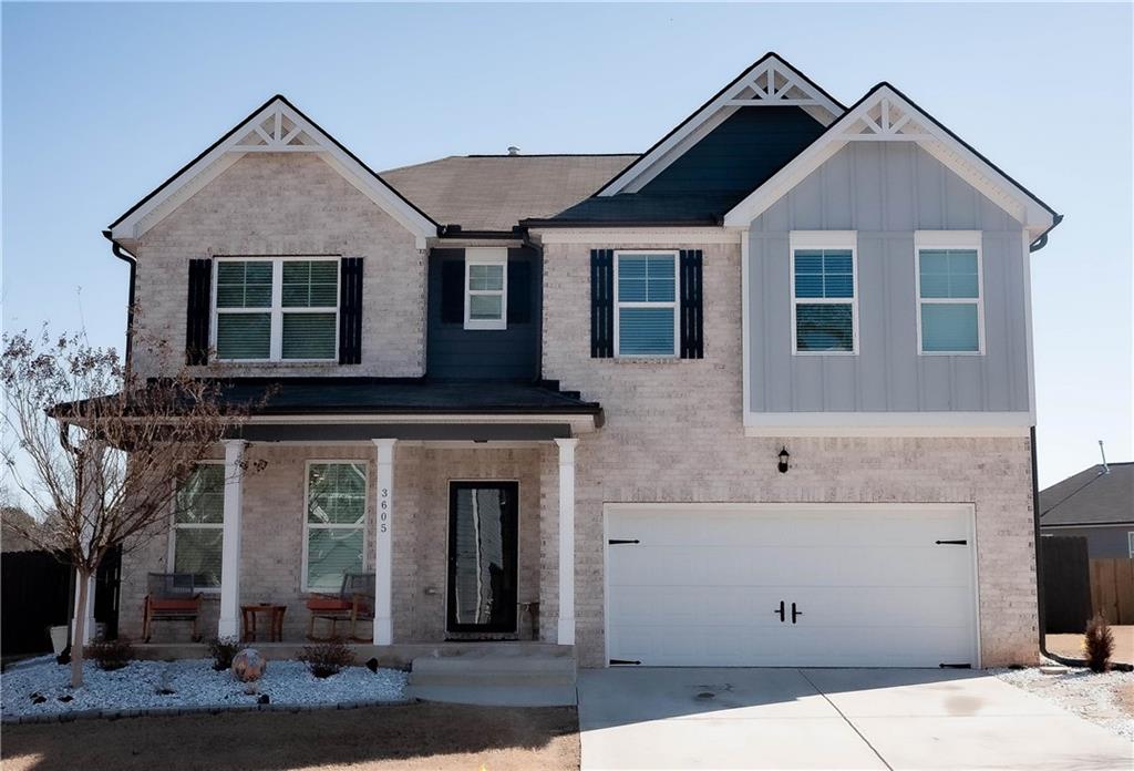 3605 Broadwick Lane Stonecrest, GA 30038 - Photo 2 of 18 a front view of a house with a yard and garage