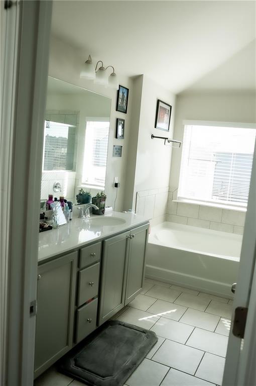 3605 Broadwick Lane Stonecrest, GA 30038 - Photo 9 of 18 a bathroom with a bathtub sink and mirror
