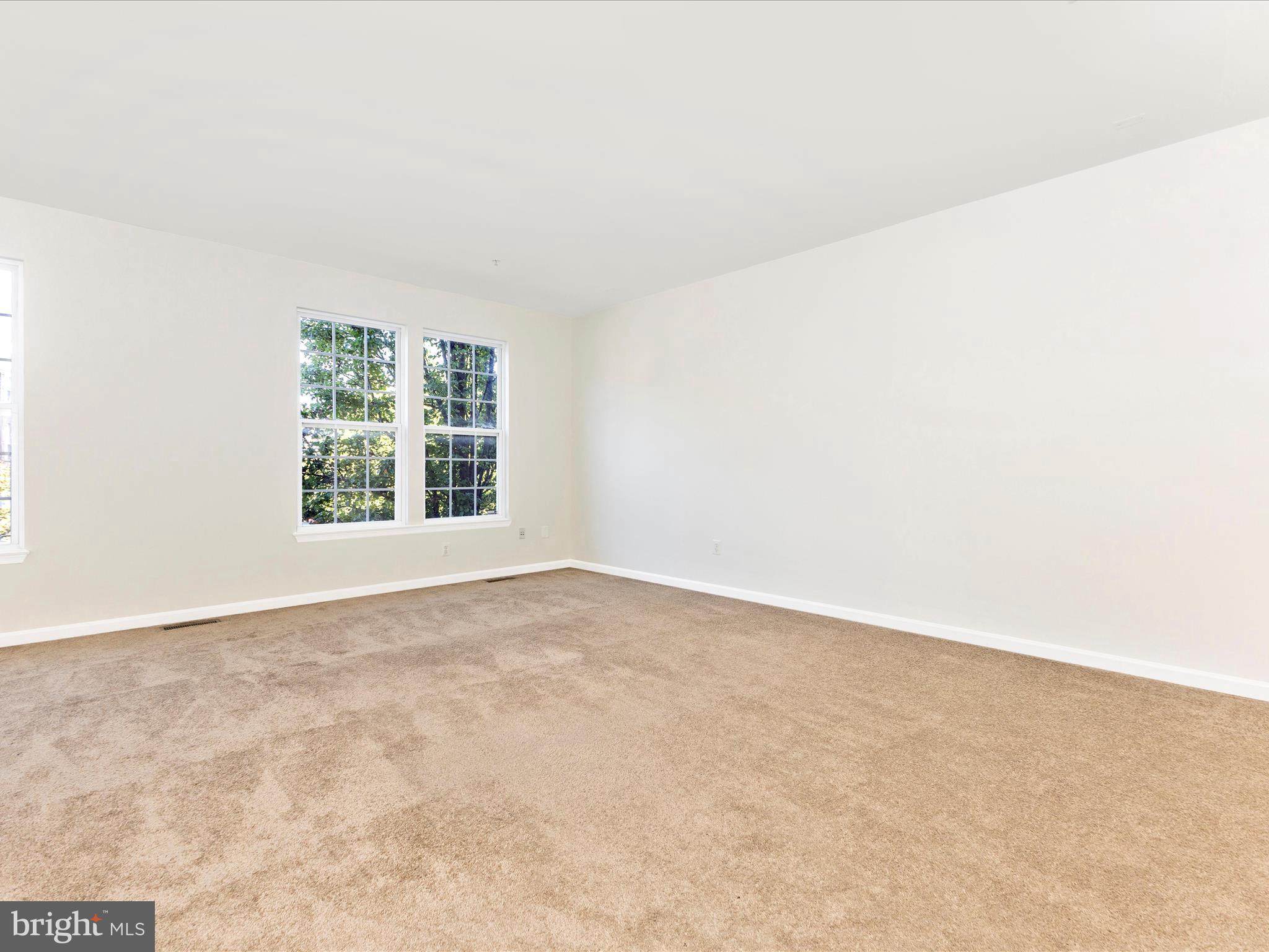 7096 Water Oak Road, Unit 121 Elkridge, MD 21075 - Photo 11 of 46 an empty room with windows