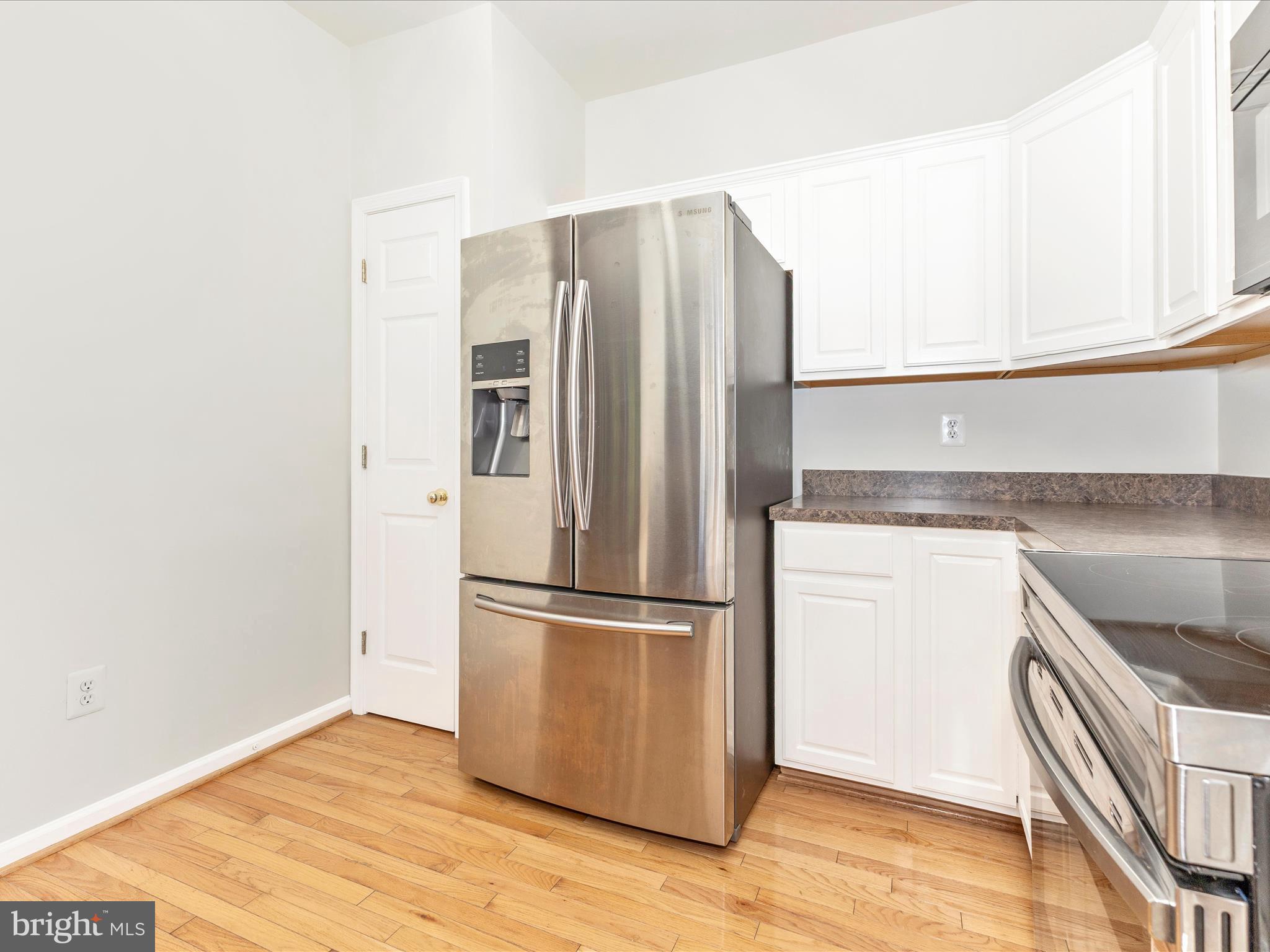 7096 Water Oak Road, Unit 121 Elkridge, MD 21075 - Photo 17 of 46 a metallic refrigerator freezer sitting in a kitchen