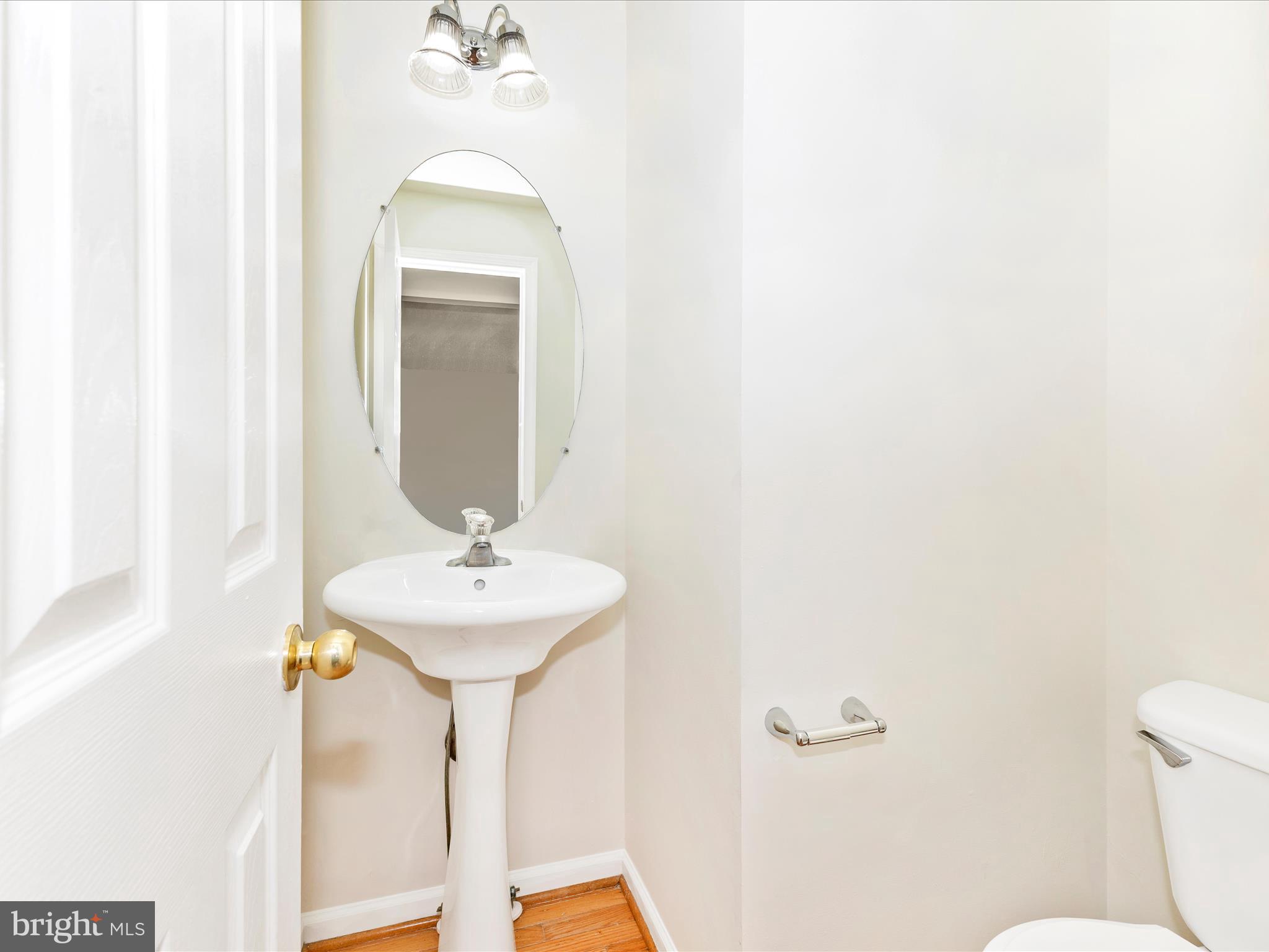7096 Water Oak Road, Unit 121 Elkridge, MD 21075 - Photo 20 of 46 a bathroom with a sink and a mirror