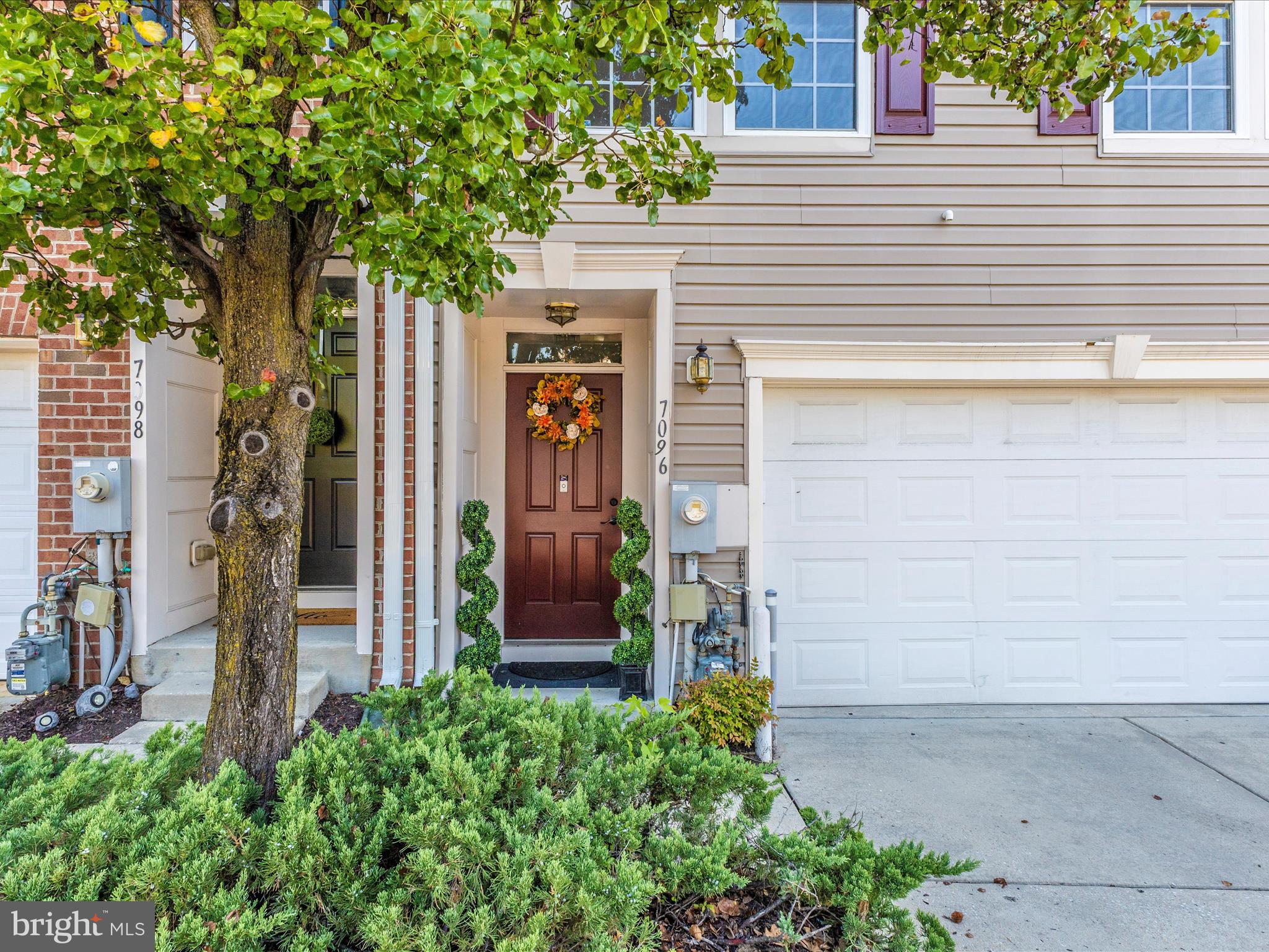 7096 Water Oak Road, Unit 121 Elkridge, MD 21075 - Photo 2 of 46 a view of a house with a tree