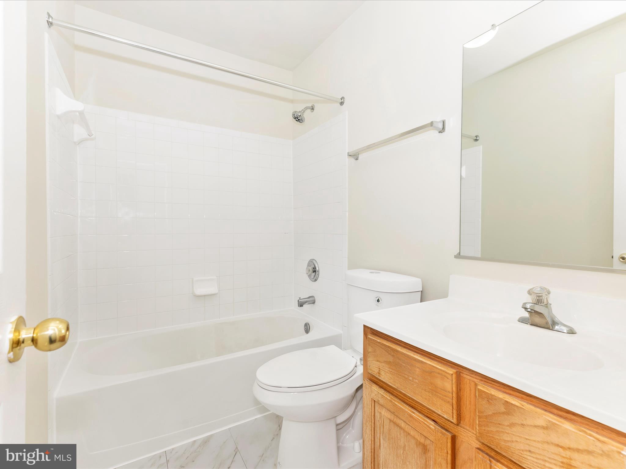 7096 Water Oak Road, Unit 121 Elkridge, MD 21075 - Photo 35 of 46 a bathroom with a sink a toilet and shower