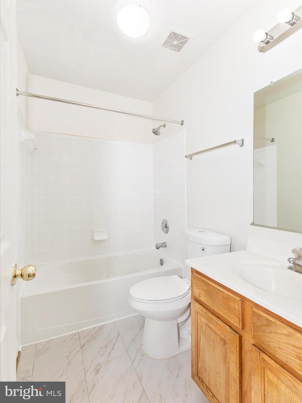 7096 Water Oak Road, Unit 121 Elkridge, MD 21075 - Photo 36 of 46 a bathroom with a sink a toilet and shower