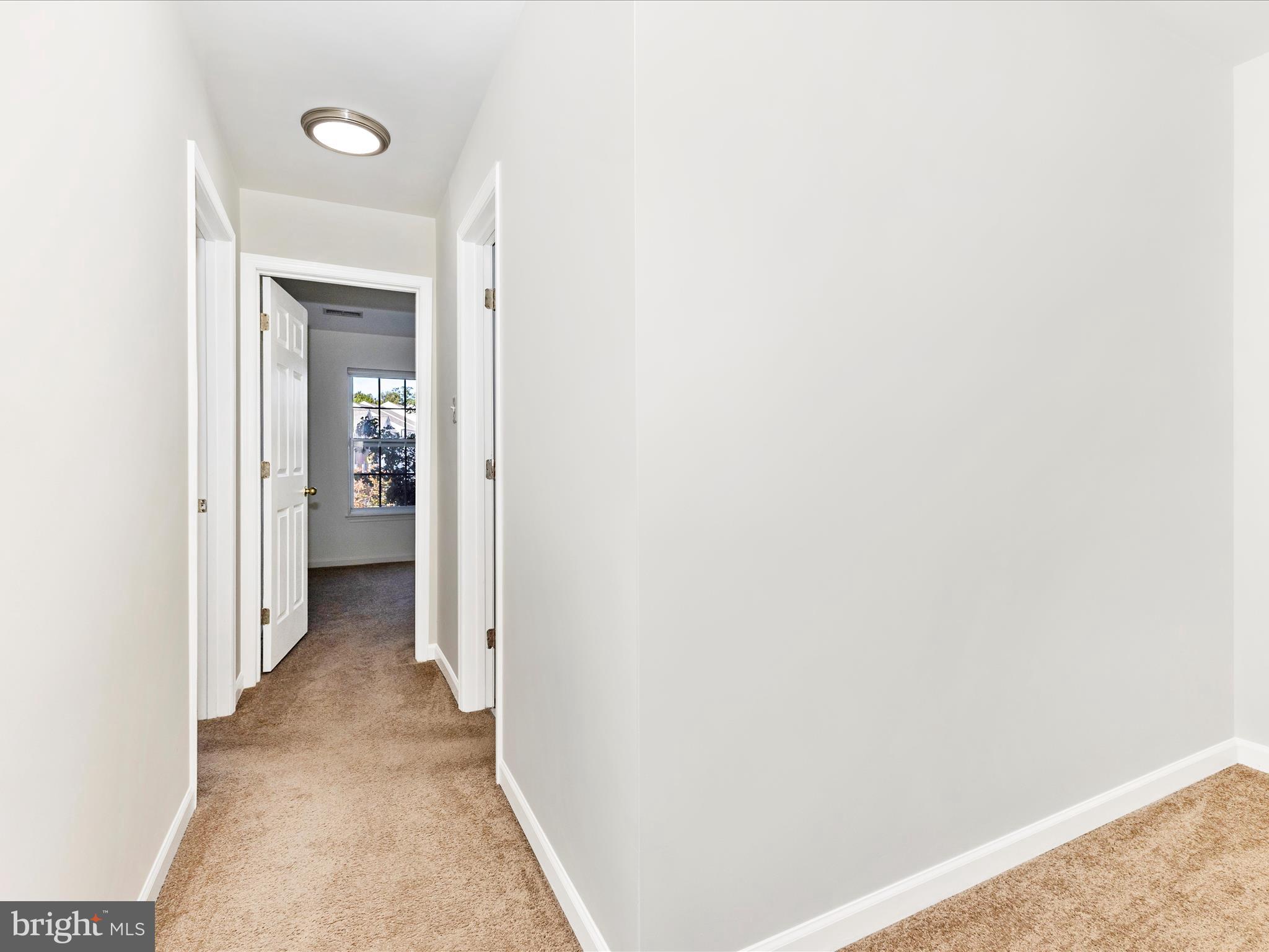 7096 Water Oak Road, Unit 121 Elkridge, MD 21075 - Photo 37 of 46 a view of a livingroom from a hallway