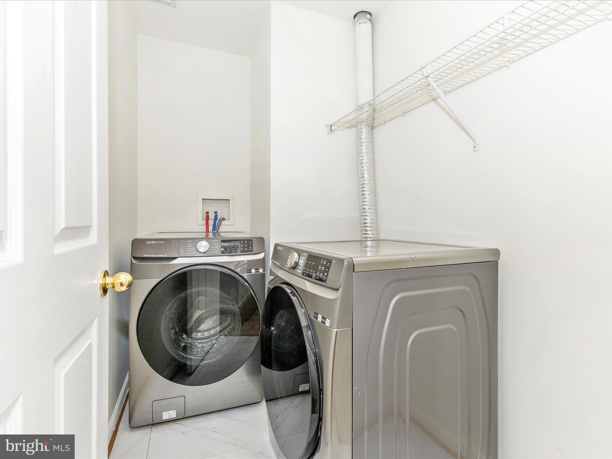 7096 Water Oak Road, Unit 121 Elkridge, MD 21075 - Photo 38 of 46 a utility room with dryer and washer