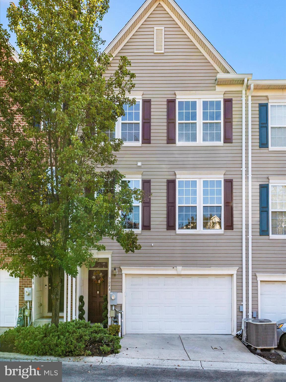 7096 Water Oak Road, Unit 121 Elkridge, MD 21075 - Photo 41 of 46 a front view of a house with a yard