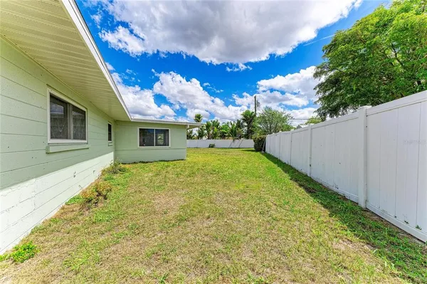 a view of a house with a big yard