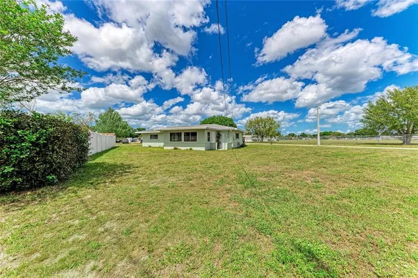 a view of a house with a big yard