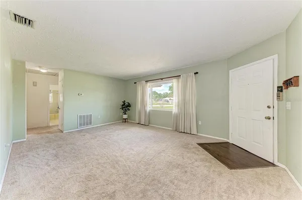 a view of an empty room and window