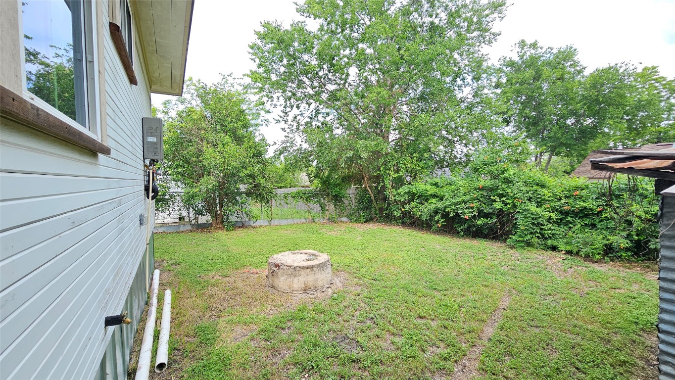 917 West 6th Street Taylor, TX 76574 - Photo 10 of 11 a view of a table and chair in the backyard