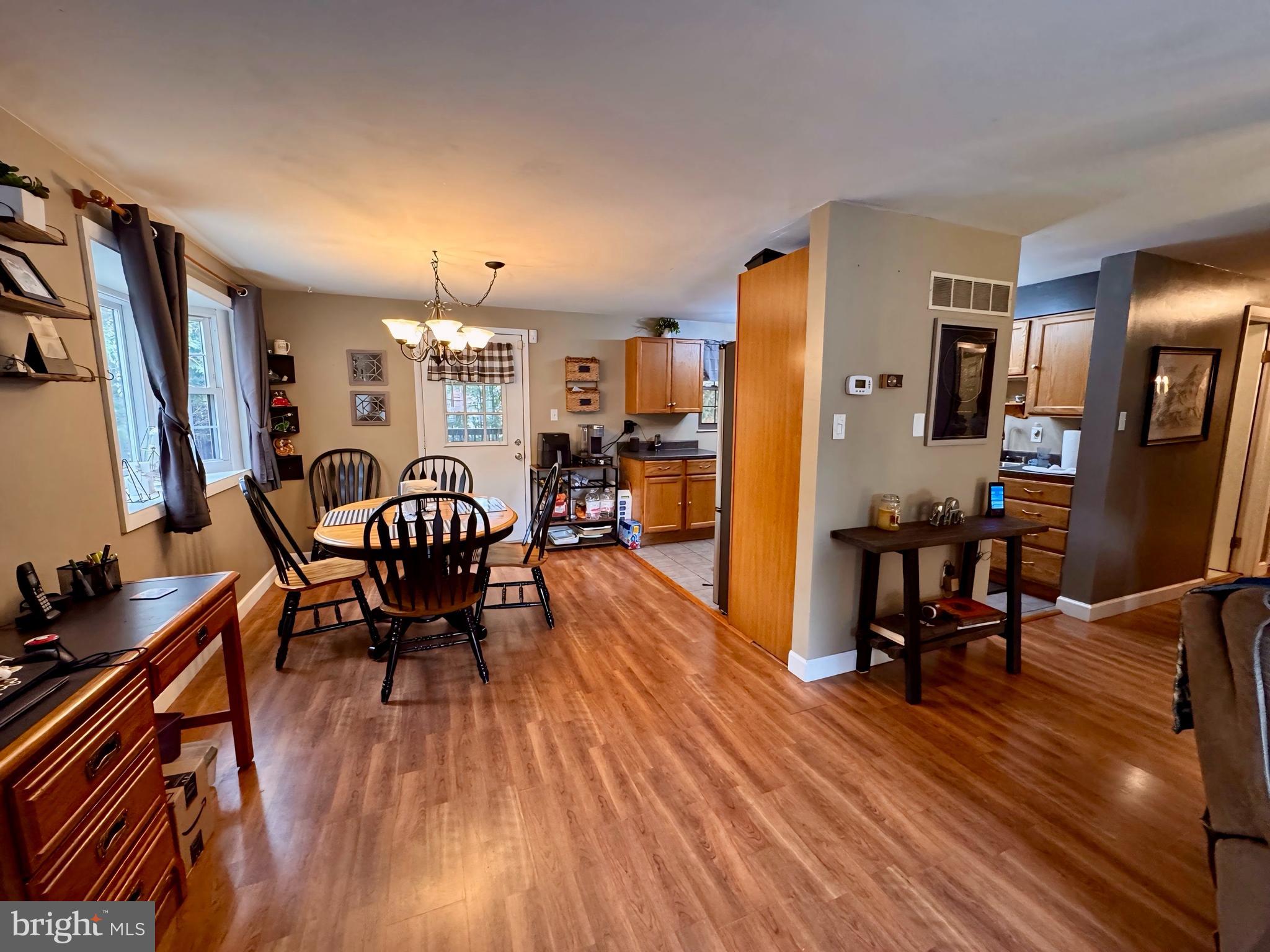 3614 Orchard Court Reading, PA 19606 - Photo 12 of 47 a view of a dining room with furniture and wooden floor