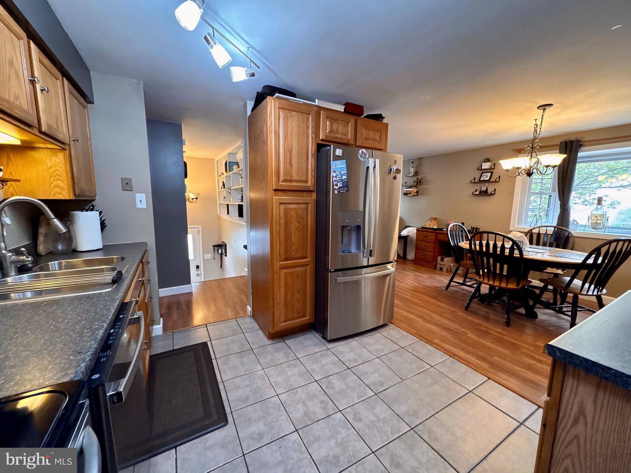 3614 Orchard Court Reading, PA 19606 - Photo 17 of 47 a kitchen with stainless steel appliances kitchen island granite countertop a refrigerator and a stove