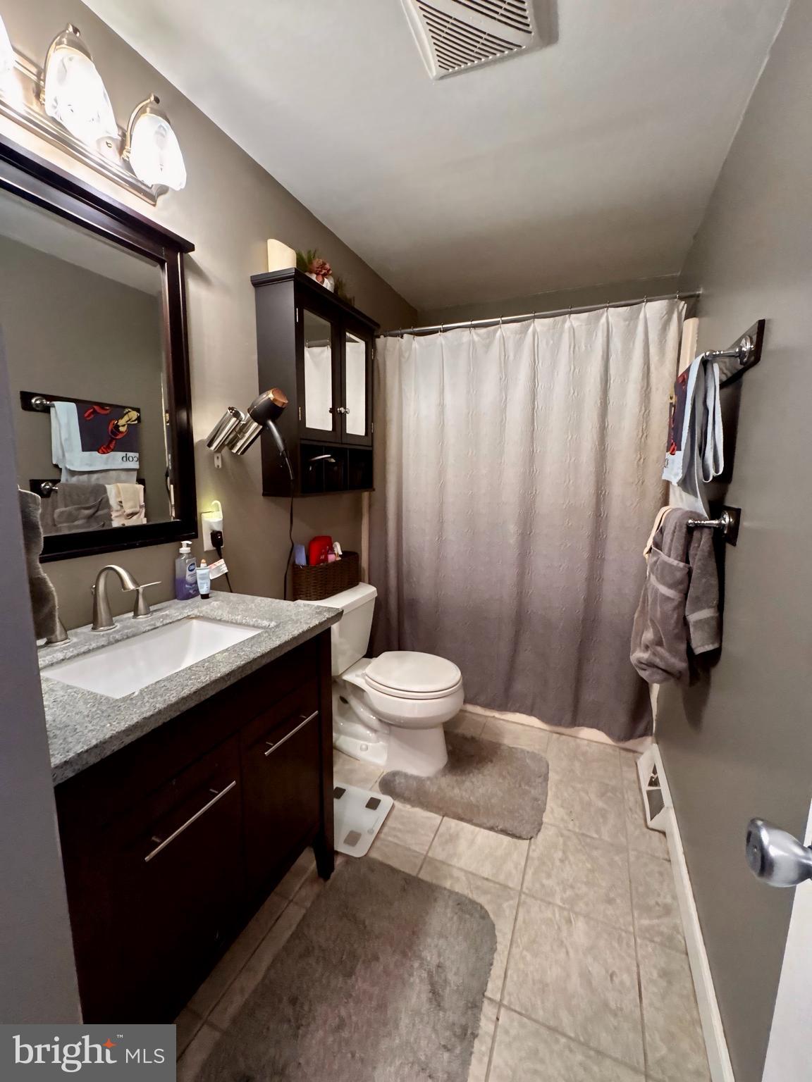 3614 Orchard Court Reading, PA 19606 - Photo 21 of 47 a bathroom with a sink toilet double vanity and mirror