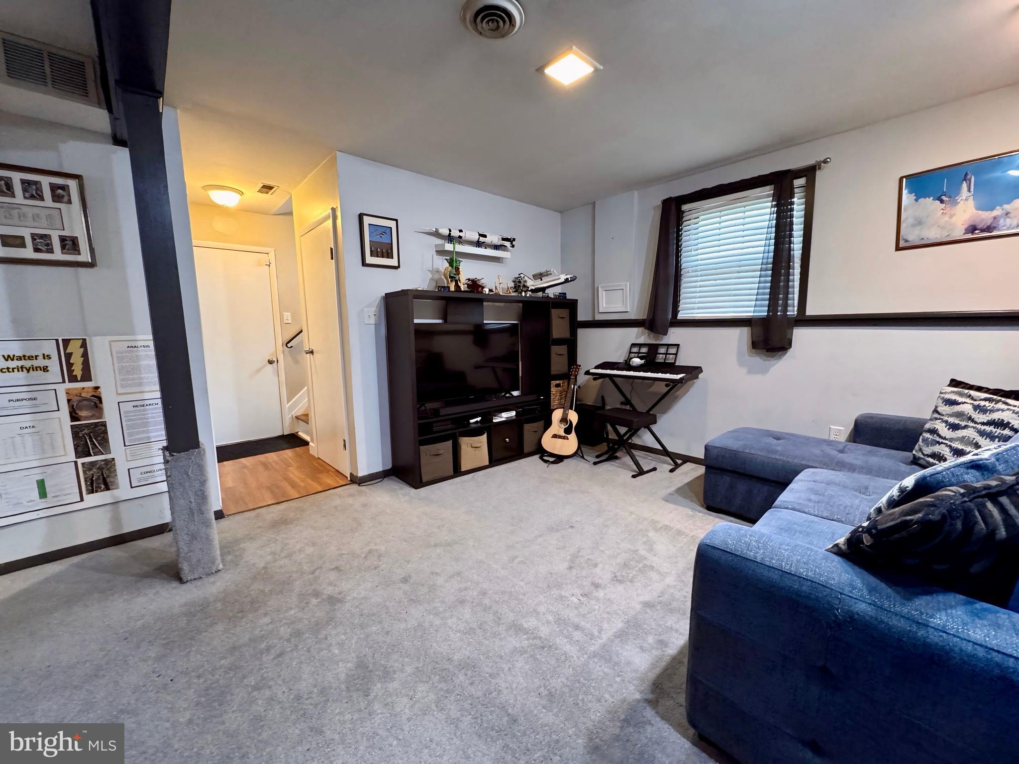 3614 Orchard Court Reading, PA 19606 - Photo 34 of 47 a living room with furniture and a flat screen tv