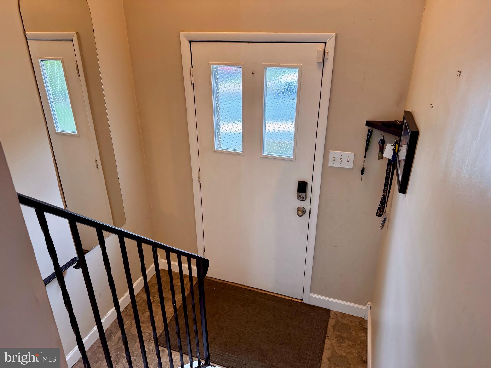 3614 Orchard Court Reading, PA 19606 - Photo 8 of 47 a view of a hallway with wooden floor and stairs